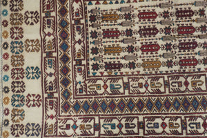 A 3.8 feet by 5 feet wool kilim, the colours used on the rug are blue, beige, brown and tan.
