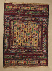 A 4 by 6 feet maliki wool kilim. The colours mainly include green, grey, tan, brick and pink.