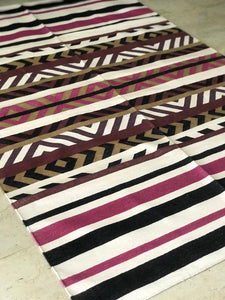 This striped cotton dhurrie is 4 feet by 6 feet.