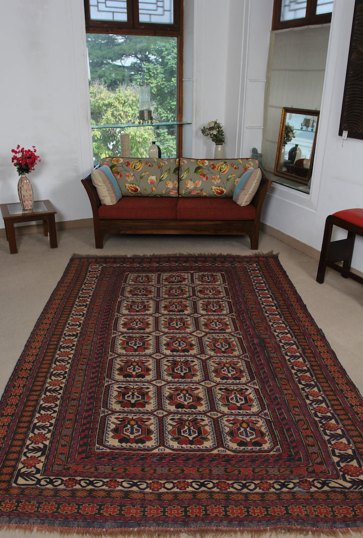 A 6.5 feet by 9.5 feet berjesta wool kilim, the colours used on the rug are red,rust,beige,brown and blue.