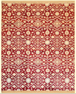 8 feet by 10 feet modern rug. 8 feet by 10 feet modern rug. The colours mainly include red, beige and tan.