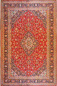 A 10 feet by 14 feet antique persian wool rug with red, beige and blue colours.