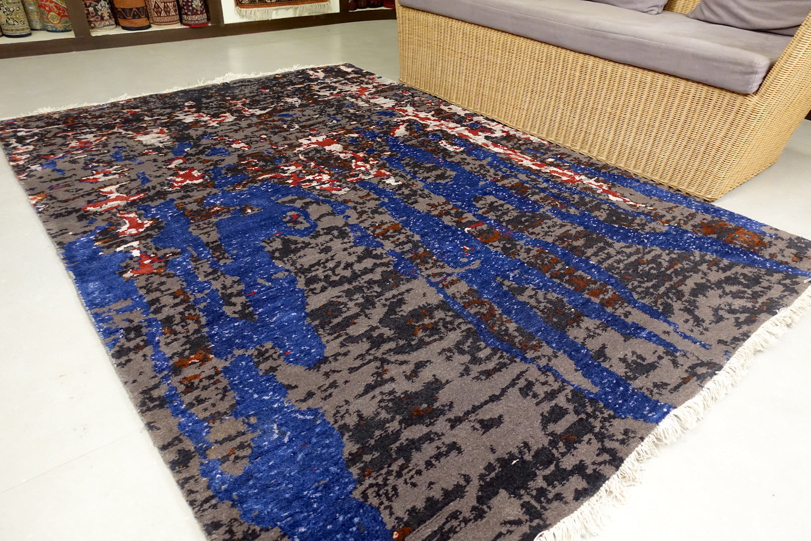 A 5 feet by 7.5 feet modern rug.