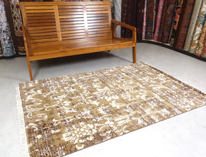 A 4 feet by 6 feet modern rug.
