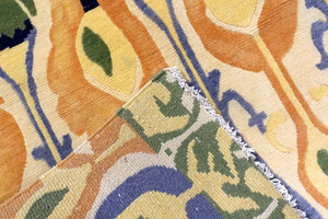 8 feet by 10 feet yellow Ikat design rug. 