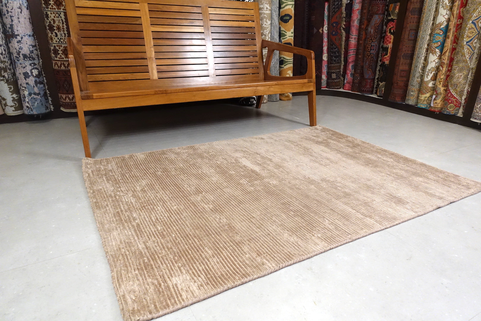 A 4 feet by 6 feet rug in brown.
