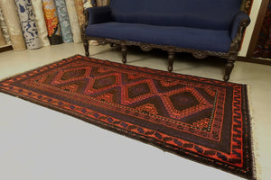 A 4 by 7 feet balochi wool rug.