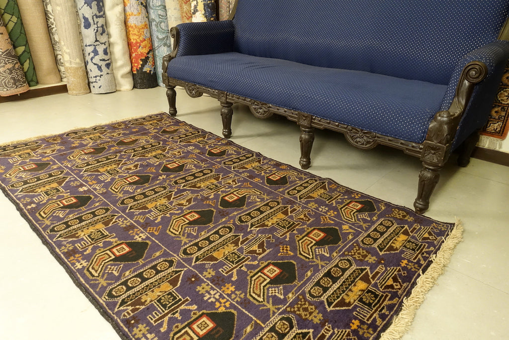 This Afghan wool rug measures 3 feet 8 inches by 6 feet 10 inches. The colours used on the rug are blue,red and brown.