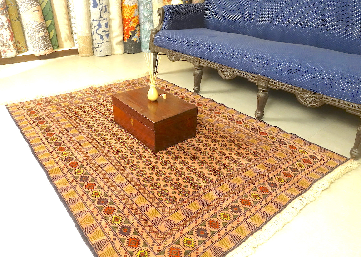 A 4 feet by 6 feet Afghan wool rug, the colours used on the rug are beige,yellow,gree,brown and rust.