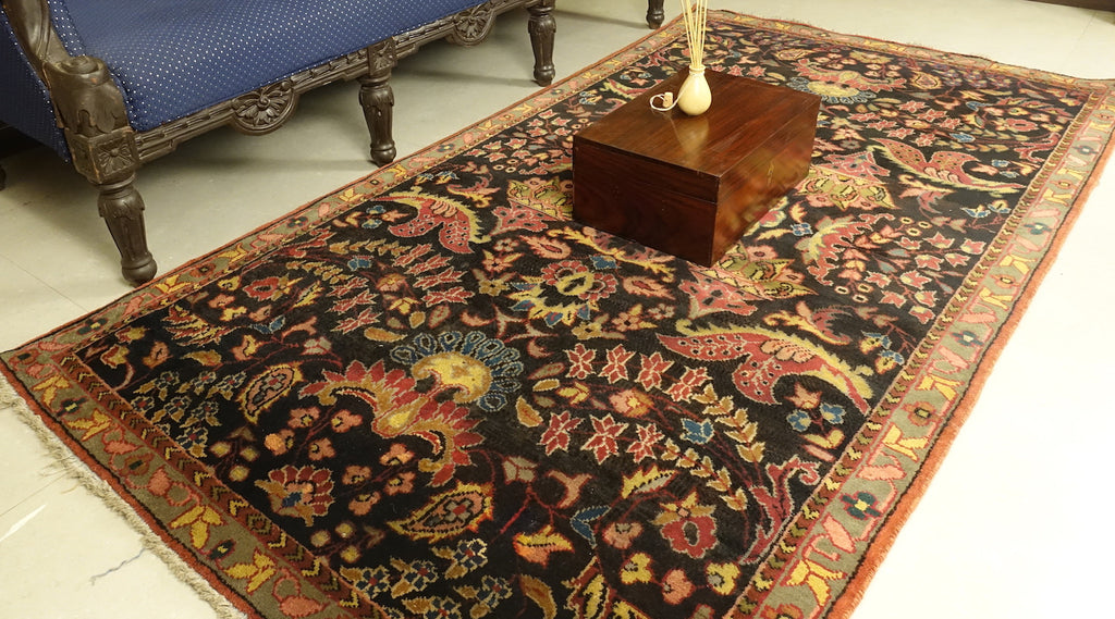 It is a 4 feet by 6 feet indian wool rug. The colours used in the rug are blue,red,beige and pink.