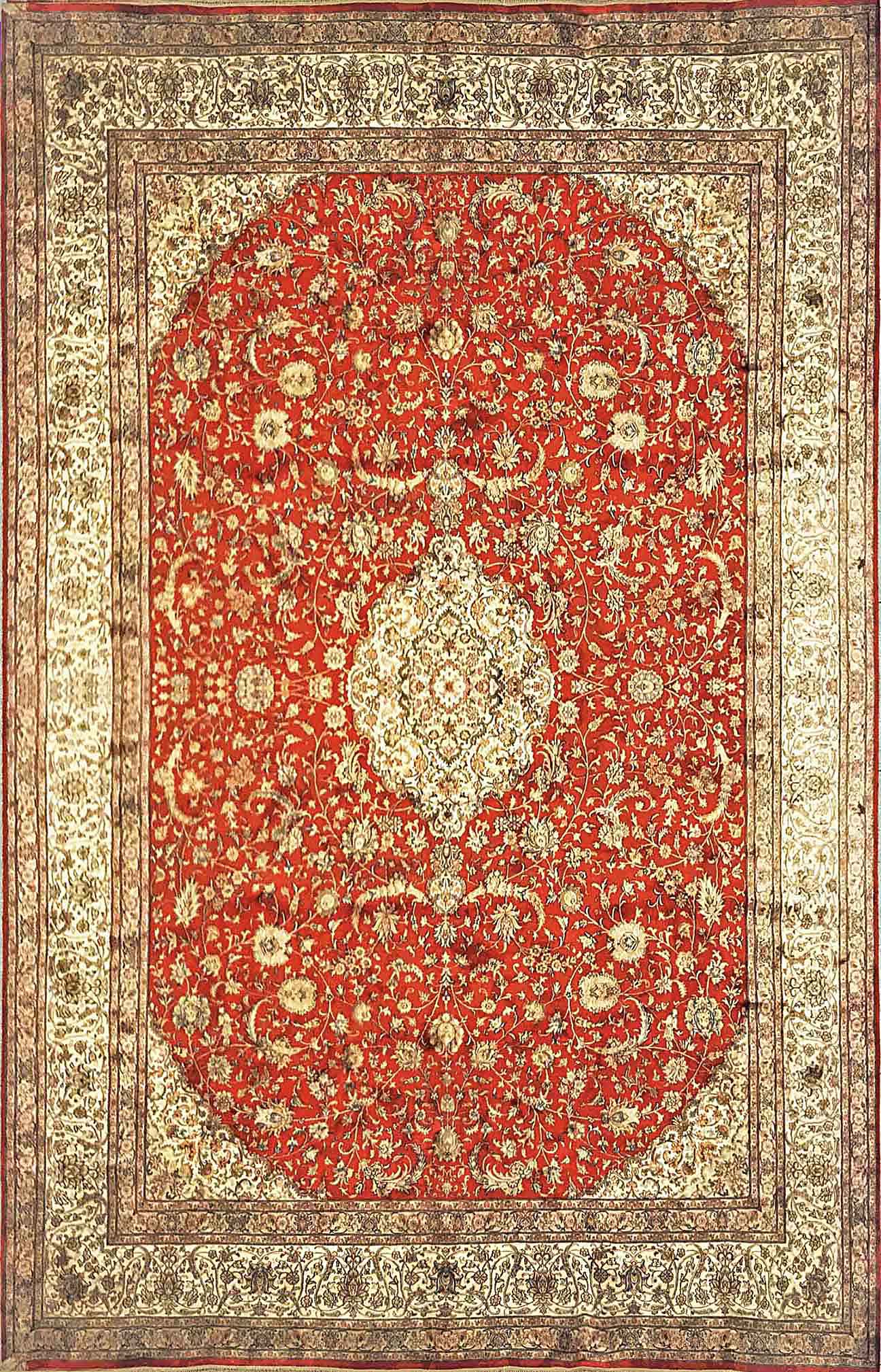 A 9 feet by 12 feet Kashmiri silk on silk carpet/rug. The colours used on the rug are rust,red,beige and golden brown.