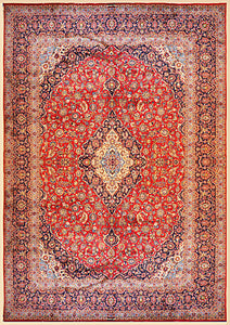 It is a 12 feet by 16 feet persian wool rug. It has a red field with beige,blue and green floral motifs. 