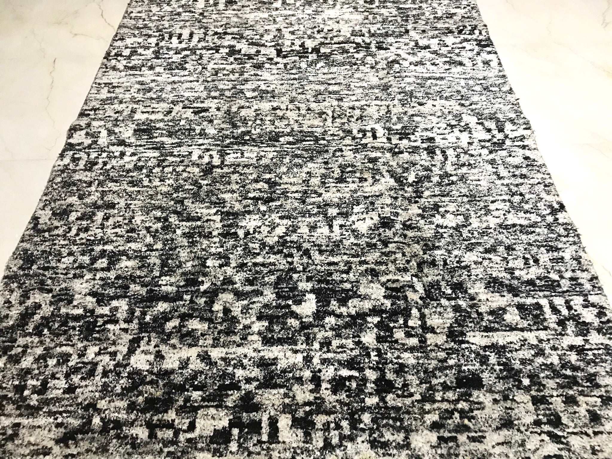 5 feet by 7 feet modern rug.
